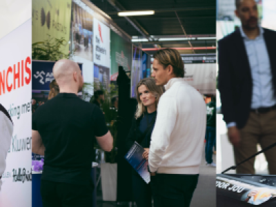 Presentatie en gesprekken tijdens een franchise-evenement in een loods in Nijkerk.