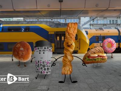 Animatie van lachende Bakker Bart producten op een NS-station met een trein op de achtergrond.